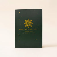 Calendrier de l'Avent Organica Beauty fermé, coffret vert et or